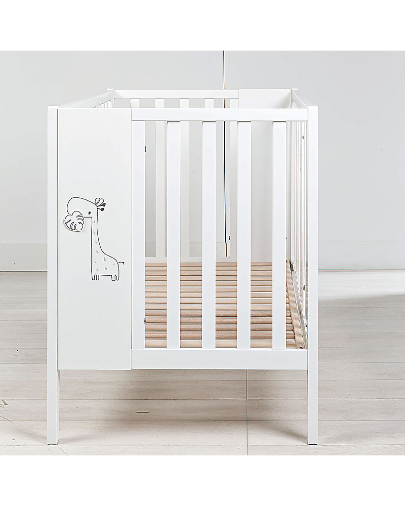 white crib with wood bars